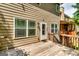 Wooden deck with stairs leading to backyard, offering seamless indoor-outdoor living at 121 Wellbrook Circle Ne, Conyers, GA 30012
