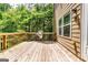 Spacious wooden back deck perfect for outdoor seating and overlooking the lush backyard at 121 Wellbrook Circle Ne, Conyers, GA 30012