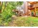 Multi-level decks in backyard with lush greenery and ample space for outdoor activities at 121 Wellbrook Circle Ne, Conyers, GA 30012