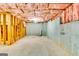 Unfinished basement ready for personalization, featuring visible framework and concrete foundation at 121 Wellbrook Circle Ne, Conyers, GA 30012