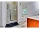 Bathroom featuring a shower with glass doors, a large tub, and a vanity at 121 Wellbrook Circle Ne, Conyers, GA 30012