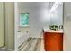Bathroom featuring a large tub, double sink vanity, and a window allowing in plenty of light at 121 Wellbrook Circle Ne, Conyers, GA 30012