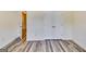 Bright bedroom with a closet and neutral walls complemented by modern wood-look flooring at 121 Wellbrook Circle Ne, Conyers, GA 30012