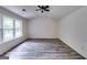 Spacious bedroom featuring vaulted ceilings, a ceiling fan, and large windows at 121 Wellbrook Circle Ne, Conyers, GA 30012
