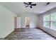 Bright bedroom with painted walls, ceiling fan, and large windows that let in lots of natural light at 121 Wellbrook Circle Ne, Conyers, GA 30012