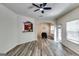 Cozy living room with hardwood floors, lots of windows, and access to the dining area at 121 Wellbrook Circle Ne, Conyers, GA 30012