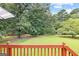 Expansive backyard featuring lush lawn, mature trees, and a sense of privacy at 20 Knollwood Pl, Covington, GA 30014