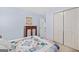 Comfortable bedroom with a patchwork quilt and ample closet space at 20 Knollwood Pl, Covington, GA 30014