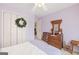 Relaxing bedroom features calm color, antique dresser, closet and ceiling fan at 20 Knollwood Pl, Covington, GA 30014