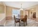 Inviting dining room with elegant decor, striped walls, and a round table at 20 Knollwood Pl, Covington, GA 30014