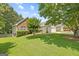 Single-Gathering home with a mix of brick and siding, set on a green lawn at 20 Knollwood Pl, Covington, GA 30014