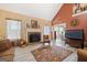 Cozy living room features a fireplace, large windows, stylish furniture, and an open layout for seamless entertaining at 20 Knollwood Pl, Covington, GA 30014