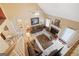 Spacious living room with vaulted ceilings, fireplace, ceiling fan, and stylish furnishings, offering a comfortable atmosphere at 20 Knollwood Pl, Covington, GA 30014