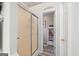 Clean shower with sliding glass doors and a doorway leading to the organized linen closet at 20 Knollwood Pl, Covington, GA 30014