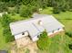 Aerial view of the home featuring a metal roof, situated in a serene wooded area at 24 Shiloh Church Rd, Carrollton, GA 30116
