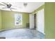 Bedroom with ceiling fan, window and closet, offering a functional living space at 24 Shiloh Church Rd, Carrollton, GA 30116