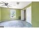 Bedroom with ceiling fan, window and closet, offering a functional living space at 24 Shiloh Church Rd, Carrollton, GA 30116