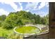 Backyard pool and wooden deck, ideal for outdoor recreation and entertaining guests at 24 Shiloh Church Rd, Carrollton, GA 30116