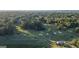 Scenic aerial view of a well-manicured golf course with lush trees and homes, a perfect setting for leisurely activities at 1190 Plantation Dr, Villa Rica, GA 30180