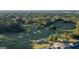 An aerial view shows a picturesque golf course, lush trees and elegant homes, ideal for an active lifestyle at 1190 Plantation Dr, Villa Rica, GA 30180
