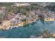 Picturesque aerial shot of lakefront properties with docks surrounded by lush greenery at 1190 Plantation Dr, Villa Rica, GA 30180