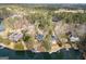 Stunning aerial view of waterfront homes nestled among trees and docks on a sunny day at 1190 Plantation Dr, Villa Rica, GA 30180