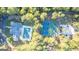 Aerial view of a community recreation area featuring a pool, tennis courts and ample parking at 1190 Plantation Dr, Villa Rica, GA 30180