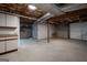 Unfinished basement with concrete floor and exposed beams, offering potential for future expansion at 1190 Plantation Dr, Villa Rica, GA 30180