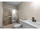 Bright bathroom with a marble vanity and a shower-tub combo at 1190 Plantation Dr, Villa Rica, GA 30180