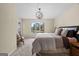 Inviting bedroom with large window, lake views, door to patio, and soft neutral tones at 1190 Plantation Dr, Villa Rica, GA 30180