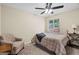 Comfortable bedroom featuring a ceiling fan and a window with natural light at 1190 Plantation Dr, Villa Rica, GA 30180