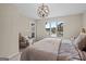 Inviting bedroom featuring a large window with lake views and a door to the patio at 1190 Plantation Dr, Villa Rica, GA 30180