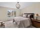 Inviting bedroom featuring a large window with lake views and soft neutral tones at 1190 Plantation Dr, Villa Rica, GA 30180
