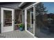 View of the home's deck featuring screened-in porch, sliding glass doors, and outdoor space at 1190 Plantation Dr, Villa Rica, GA 30180