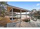 Spacious covered dock with boat slip and waterfront views at 1190 Plantation Dr, Villa Rica, GA 30180