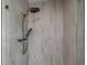 Modern shower with a rainfall shower head and sleek tile at 1190 Plantation Dr, Villa Rica, GA 30180