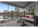 Charming screened porch with lake views, offering a peaceful outdoor living space at 1190 Plantation Dr, Villa Rica, GA 30180