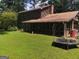 View of a backyard and trampoline with an exterior of the house at 963 Blackberry Ct, Ellenwood, GA 30294