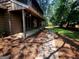 View of a beautiful back yard with trees and a walkway at 963 Blackberry Ct, Ellenwood, GA 30294