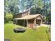 View of a backyard and trampoline with an exterior of the house at 963 Blackberry Ct, Ellenwood, GA 30294