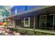 Charming home featuring a covered front porch with seating, wood siding, and shutters at 963 Blackberry Ct, Ellenwood, GA 30294