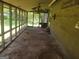View of the back porch on a house, with bare flooring at 963 Blackberry Ct, Ellenwood, GA 30294