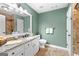 Bathroom featuring a vanity with granite countertop, tiled floors, and ample lighting at 275 Rehobeth Way, Fayetteville, GA 30214