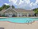 Community pool with stone accents, lounge chairs, and a clean, inviting atmosphere for residents at 275 Rehobeth Way, Fayetteville, GA 30214