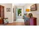 Foyer featuring hardwood floors, a decorative table, and a view of the landscaped front yard at 275 Rehobeth Way, Fayetteville, GA 30214