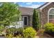 Welcoming front entrance with stone accents, manicured shrubs, and a decorative front door at 275 Rehobeth Way, Fayetteville, GA 30214