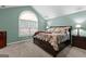 Inviting main bedroom features a vaulted ceiling and large arched window at 275 Rehobeth Way, Fayetteville, GA 30214