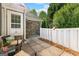 Cozy outdoor patio space with comfortable seating, enclosed by a white privacy fence at 275 Rehobeth Way, Fayetteville, GA 30214