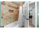 Detailed shot of tiled shower and wall niche with tile and shower curtain at 275 Rehobeth Way, Fayetteville, GA 30214