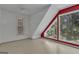 Bright attic space with large windows and built-in shelving, offering a unique living area at 390 Stoneridge Way, Fayetteville, GA 30215